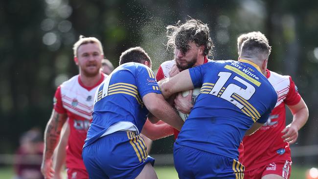 Kincumber’s Damon Brady taking a hit-up into the Toukley defence. Photo: Sue Graham