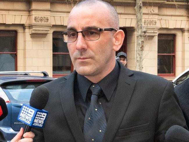 Jason Roberts Sentencing at the Victorian Supreme Court. Jason Roberts leaves the Supreme Court with his legal team. Picture: Tony Gough