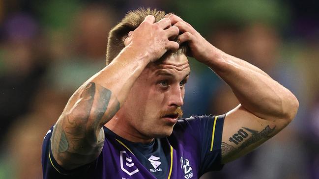 MELBOURNE, AUSTRALIA - APRIL 30:  Cameron Munster of the Storm reacts after missing a conversion during the round eight NRL match between the Melbourne Storm and the Cronulla Sharks at AAMI Park on April 30, 2021, in Melbourne, Australia. (Photo by Robert Cianflone/Getty Images)