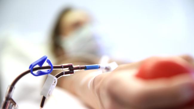 A recovered COVID-19 patient donates blood plasma for research into coronavirus antibodies, as studies have shown for the first time that antibodies can protect against reinfection. Picture: Getty