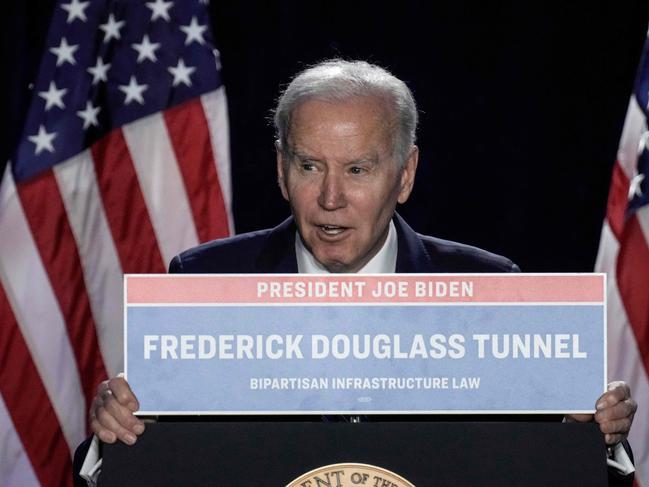 BALTIMORE, MARYLAND - MARCH 1: U.S. President Joe Biden holds up a sign for the Frederick Douglass Tunnel as he speaks during the annual House Democrats Issues Conference at the Hyatt Regency Hotel March 1, 2023 in Baltimore, Maryland. Biden spoke on a range of issues, including bipartisan legislation passed in the first two years of his presidency.   Drew Angerer/Getty Images/AFP (Photo by Drew Angerer / GETTY IMAGES NORTH AMERICA / Getty Images via AFP)