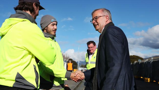 Prime Minister Anthony Albanese with apprentice Lukas Bird and apprentice Izaiah Meni from St Joseph Affordable Homes. Prime Minister Anthony Albanese in Bridgewater Tasmania in relation to housing. Picture: Nikki Davis-Jones