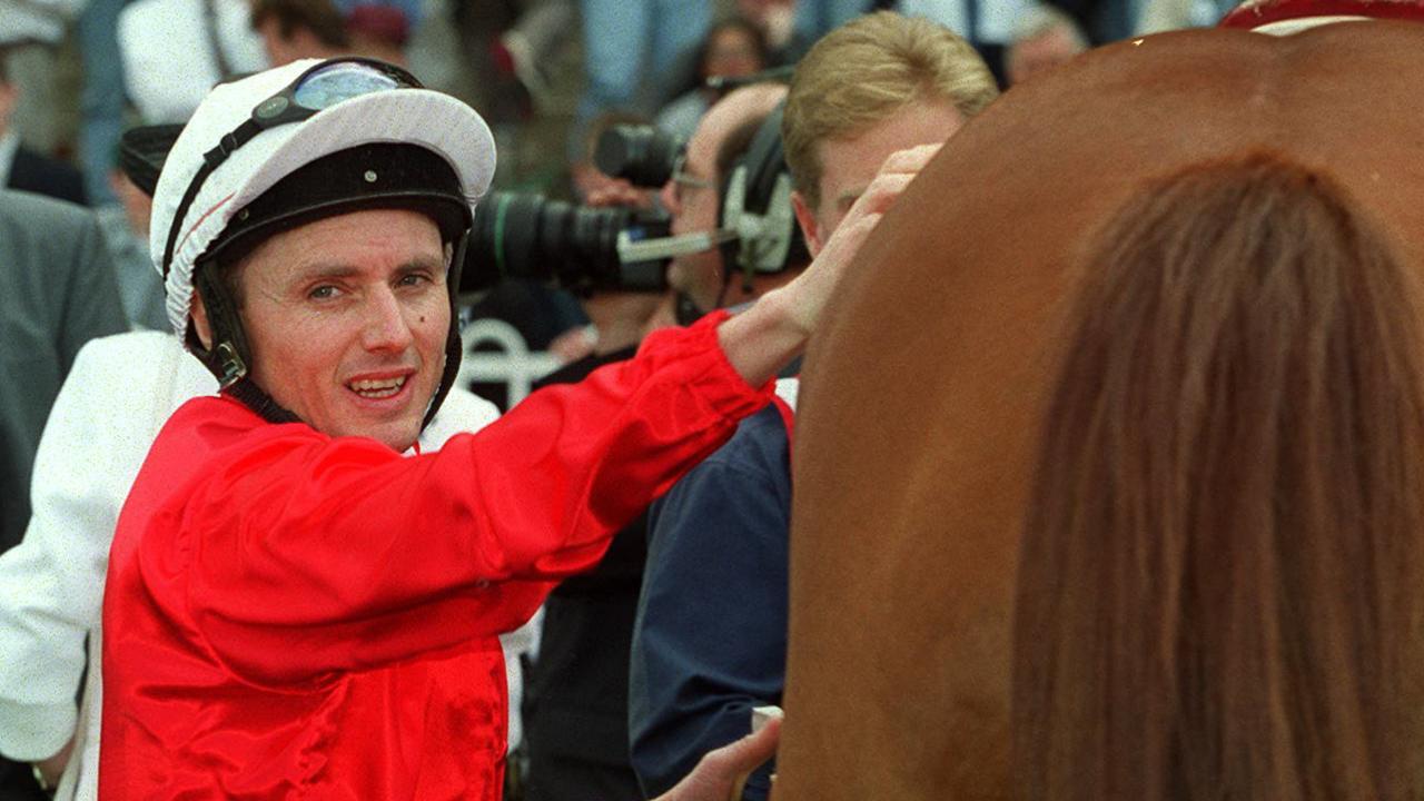 Jockey Shane Dye unsaddling racehorse Tie/The/Knot after winning Race 5 at Rosehill 18 Sep 1999. p/