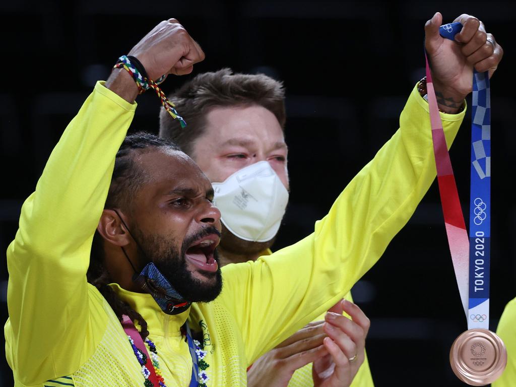 Patty Mills celebrates with his bronze medal during the 2021 Tokyo Olympics. Photo: Getty Images