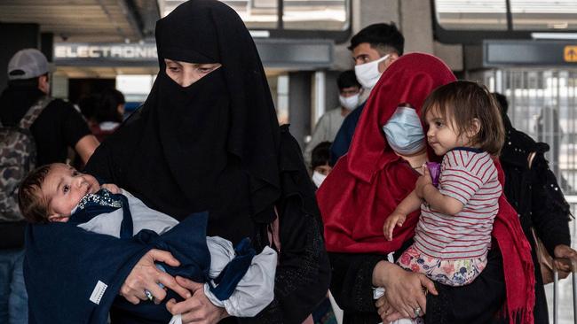 Afghan refugees after landing at Dulles International Airport in Virginia on Monday. Picture: AFP