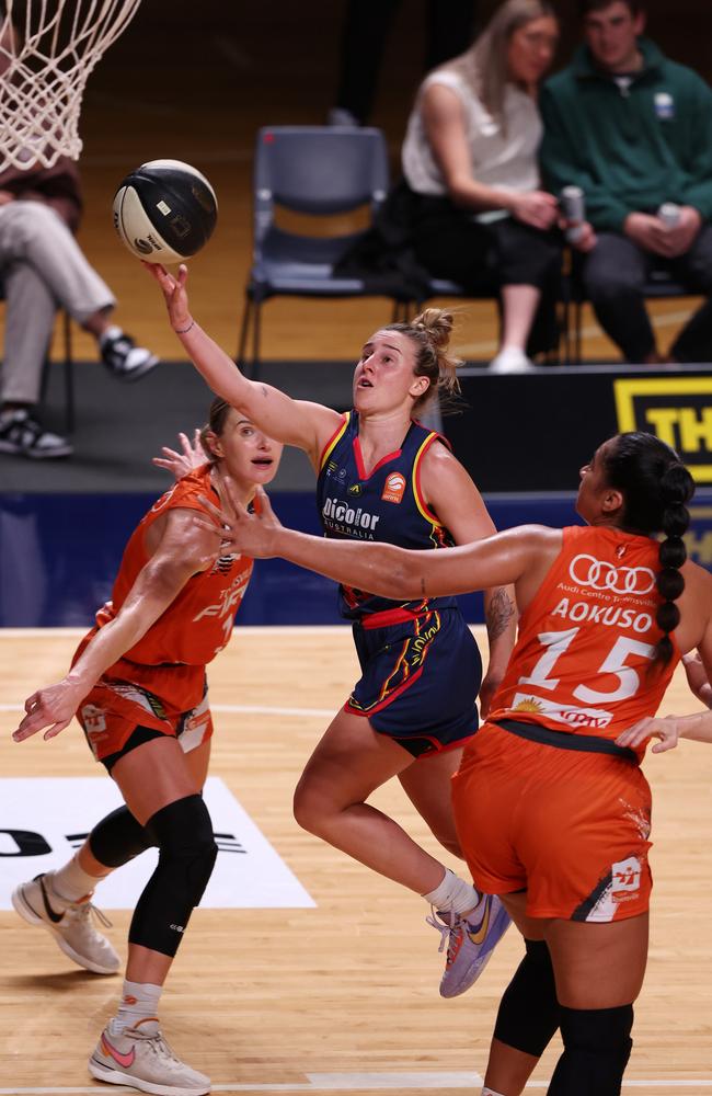 Lauren Mansfield of the Adelaide Lightning and Alice Kunek of the Townsville Fire and Zitina Aokuso of the Townsville Fire during the WNBL match between Adelaide Lightning and Townsville Fire at Adelaide Arena, on November 23, 2023, in Adelaide, Australia. (Photo by Sarah Reed/Getty Images)