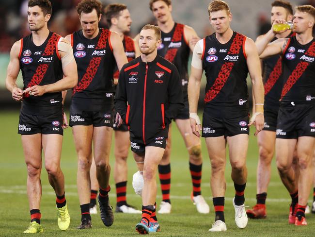 Devon Smith with his knee iced and bandaged after Essendon’s Anzac Day match against Collingwood. Picture: Getty Images