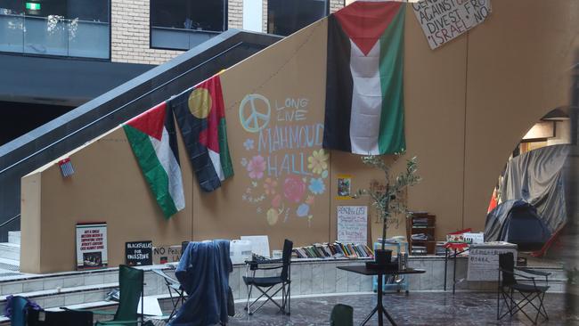 Protesters have hung flags and written on the walls of the building. Picture: David Crosling