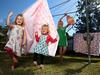 Amy Beard from Wongawallan is throwing a "retirement party" for her Hills Hoist after upgrading to a better clothesline. Amy and her girls Etta 4 and Millys 2 still love the old clothes line. Pics Adam Head