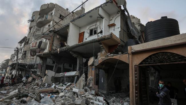 People inspect damage to their homes following Israeli air strikes in Rafah, Gaza. Picture: Getty