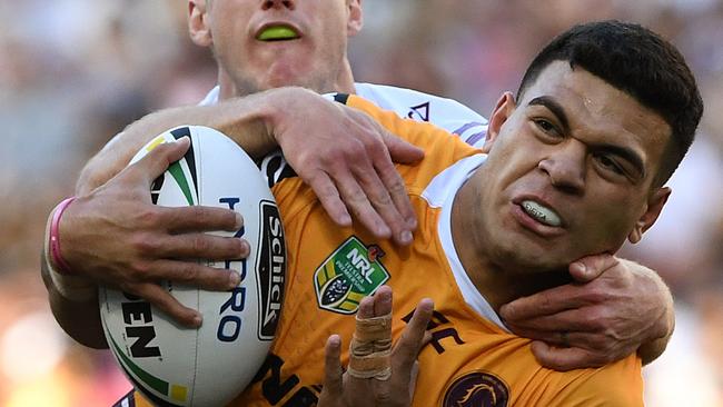 David Fafita of the Broncos is tackled by Daly Cherry-Evans of the Sea Eagles during the Round 25 NRL match between the Brisbane Broncos and the Manly-Warringah Sea Eagles at Suncorp Stadium in Brisbane, Sunday, September 2, 2018. (AAP Image/Dave Hunt) NO ARCHIVING, EDITORIAL USE ONLY