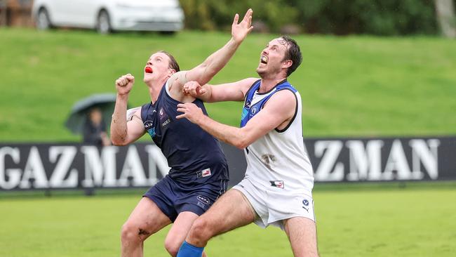 Old Melburnians Jack Spargo battles with University Blues Ayce Cordy in the ruck.Picture: George Sal