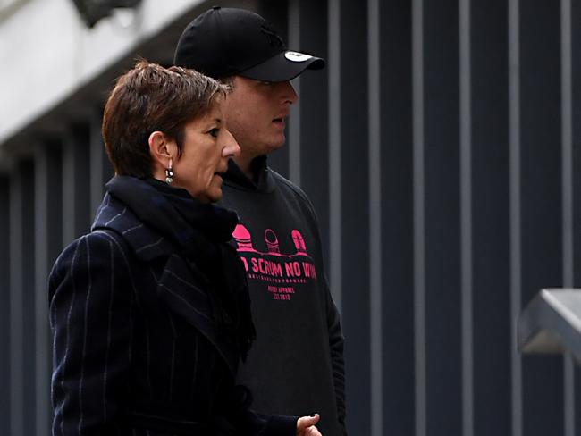 Grenoble's Irish prop Denis Coulson (R) arrives at the police station in Grenoble, French Alps. Picture:  AFP