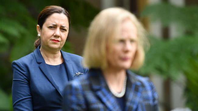 Queensland Premier Annastacia Palaszczuk (left) and Chief Medical Officer Jeannette Young (right) at a press conference where they continue to stand by their decision on lifting Queensland’s restrictions. (AAP Image/Darren England)