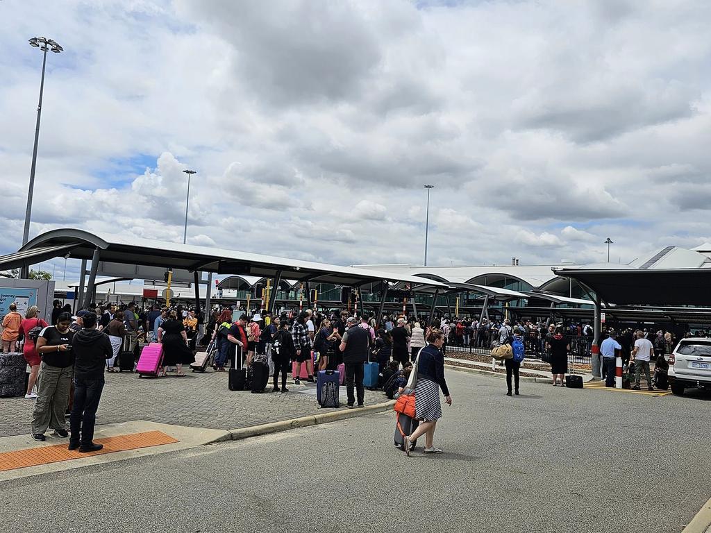 Hundreds of people were spotted outside the airport waiting further information. Photo: James Sinnet King