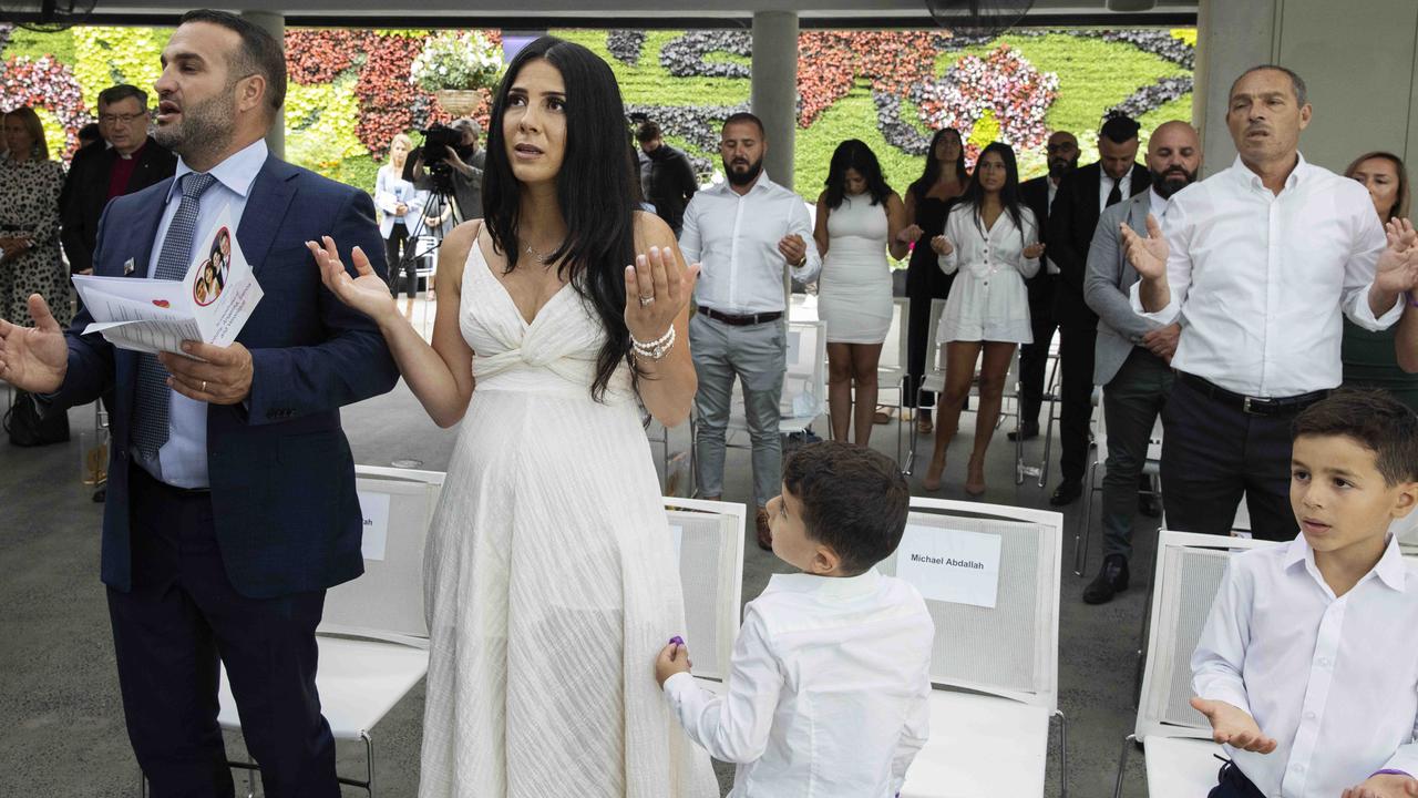 Leila and Danny Abdallah pray during the launch of i4give Day at The Calyx, Royal Botanic Gardens. Picture: Pool via NCA NewsWire/Jenny Evans