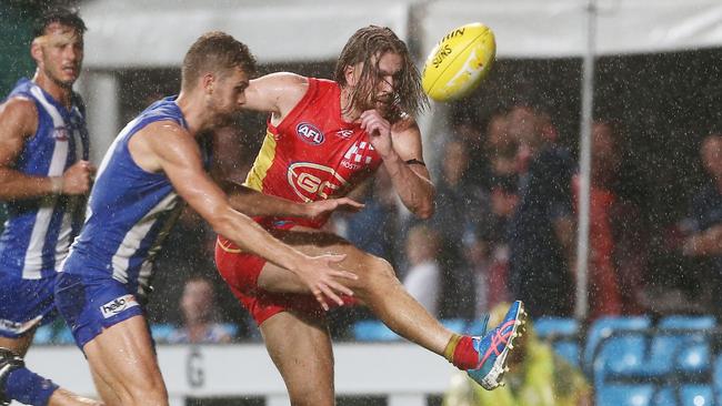 Action from the AFL match between the Gold Coast Suns and the North Melbourne Kangaroos, held at Cazalys Stadium, Cairns. Gold Coast's Aaron Young kicks a goal. PICTURE: BRENDAN RADKE.