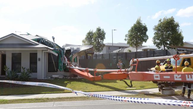 A concrete pumping truck toppled onto a house opposite where it was doing a concrete pour, Deebing Heights, Ipswich, on Friday 23rd June 2023 - Photo Steve Pohlner