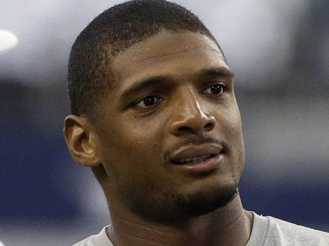 IFLE - In this Sept. 7, 2014, file photo, Dallas Cowboys Michael Sam, center, talks on the field before the start of an NFL football game against the San Francisco 49ers in Arlington, Texas. The Cowboys have released Michael Sam from the practice squad, Tuesday, Oct. 21, 2014, another setback as the NFL’s first openly gay player tries to make an active roster during the regular season for the first time. (AP Photo/LM Otero, File)