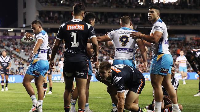 SYDNEY, AUSTRALIA - MAY 08: Phillip Sami of the Titans celebrates scoring a try during the round nine NRL match between the Wests Tigers and the Gold Coast Titans at Campbelltown Sports Stadium, on May 08, 2021, in Sydney, Australia. (Photo by Matt King/Getty Images)