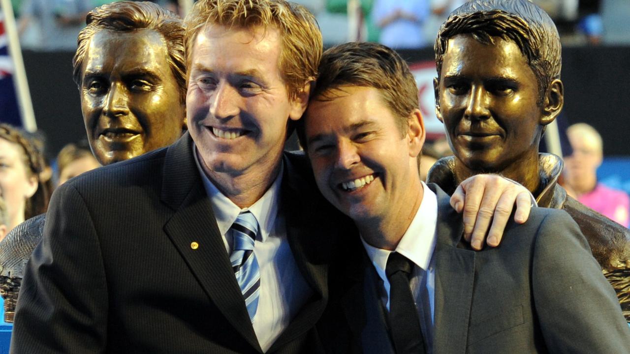 Australian doubles tennis players Todd Woodbridge and Mark Woodforde embrace as they are inducted into the Tennis Australia Hall of Fame. AAP Image/Julian Smith.