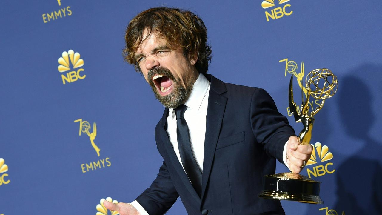 Game of Thrones star Peter Dinklage poses proudly with his statue at the 2018 Emmys. Picture: Valerie Macon/AFP