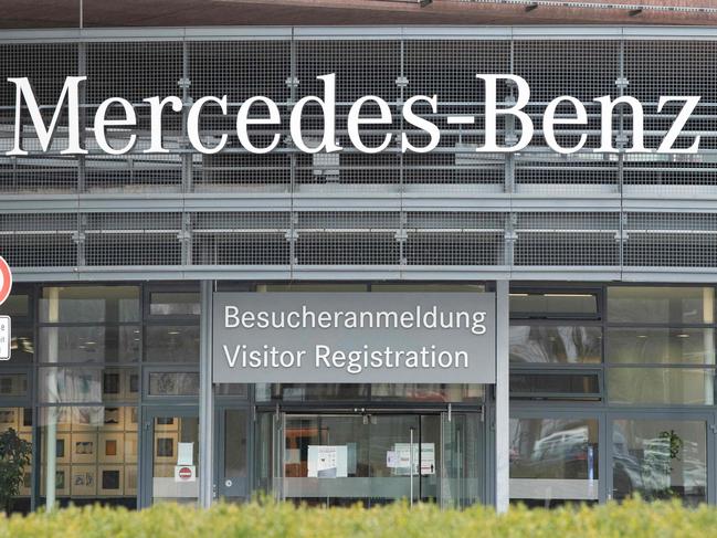 The letters Mercedes-Benz are displayed at the main entrance of the former Daimler AG headquarters in Stuttgart, southern Germany, on January 31, 2022. - The Daimler AG will rebrand as Mercedes-Benz Group AG on February 1, 2022 and will be responsible for cars and vans. The truck devision of the German car producer was separated into the Daimler Truck AG in December 2021. (Photo by THOMAS KIENZLE / AFP)