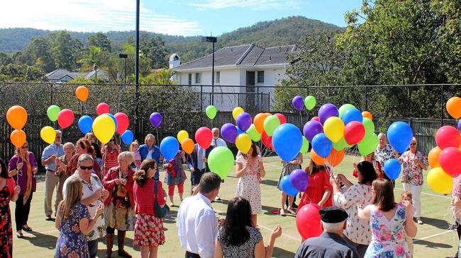 HAPPY MEMORIES: Colourful balloons about to be released at the celebration of the life of Col Searle.