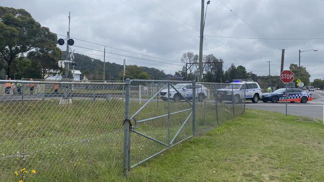 A Newcastle-bound train carrying about 70 passengers struck a car on the level crossing at Woy Woy this morning. Picture: Dana Pendrick