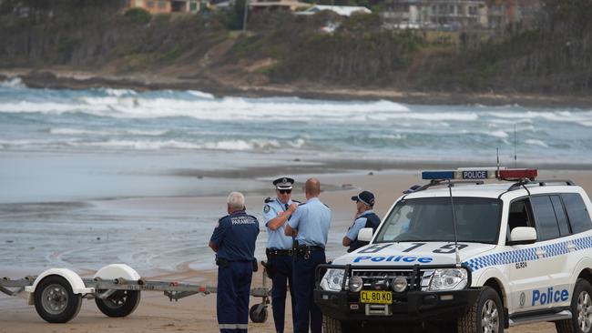 Emergency services on Woolgoolga Beach searching for missing swimmer in February last year.