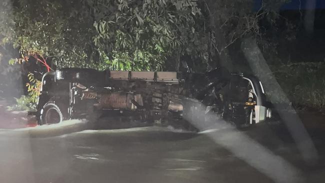 A car was submerged in water after navigating a flooded road in Berry Springs. Picture: Facebook / Rehanna Mortimer