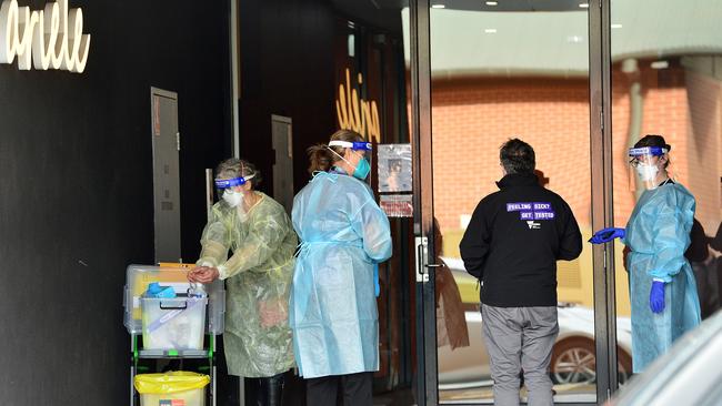 Health workers arrive at the Maribyrnong apartment block. Picture: NCA NewsWire/Nicki Connolly