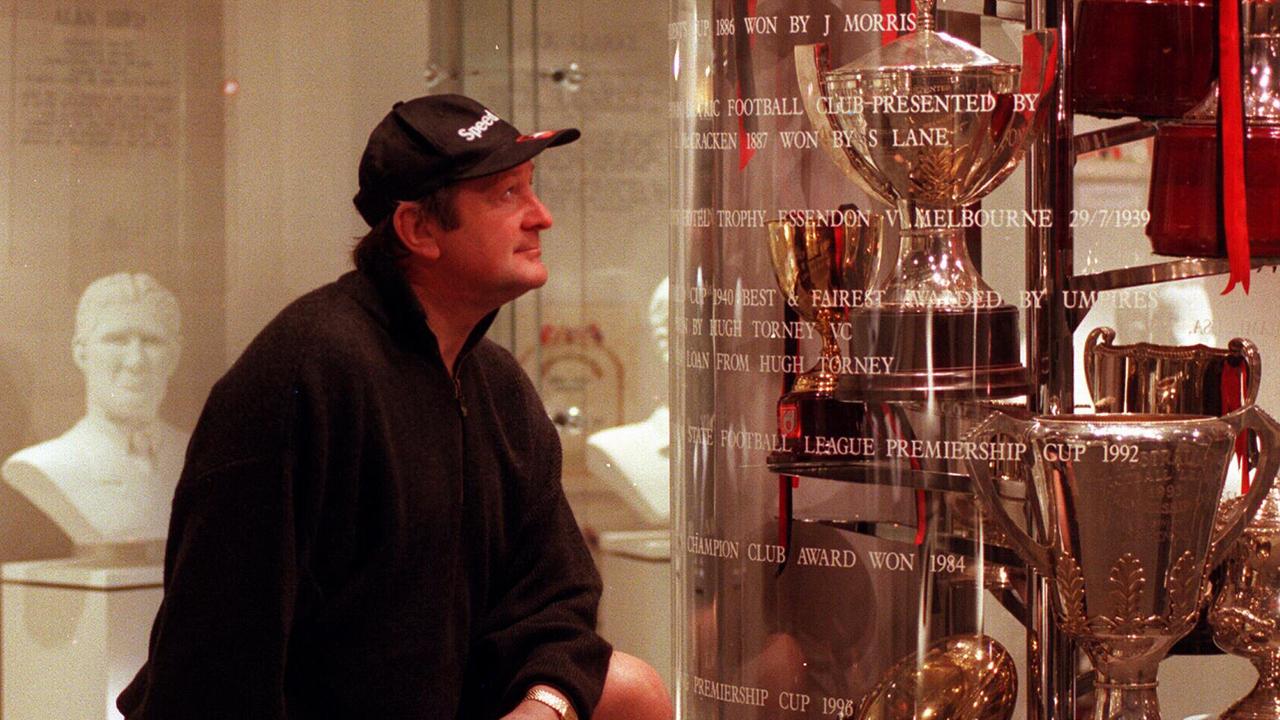 Kevin Sheedy admires Essendon’s trophy cabinet at Windy Hill.