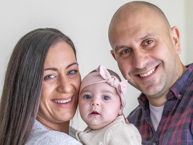 Project manager Carla Knight, 32, and her husband Paul Knight, together with daughter Olivia, 3.5 months, recently merged their private health insurance policies to save money. Picture: Tim Carrafa