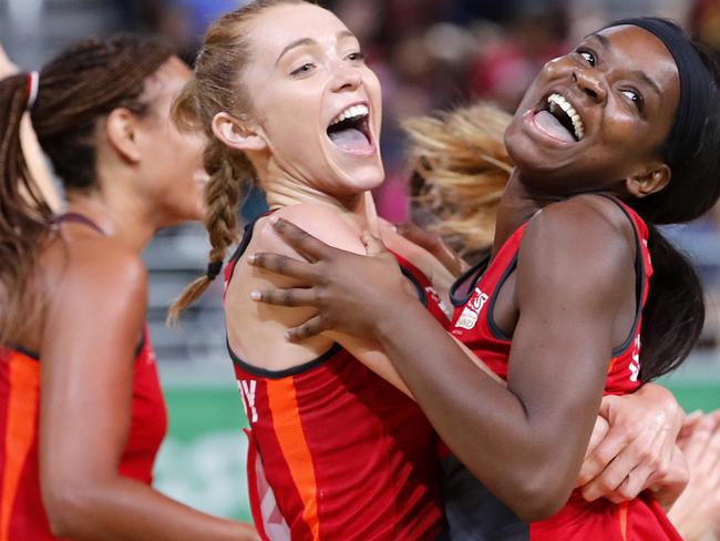 England's Helen Housby, left, and Jodie Gibson celebrate after beating New Zealand.