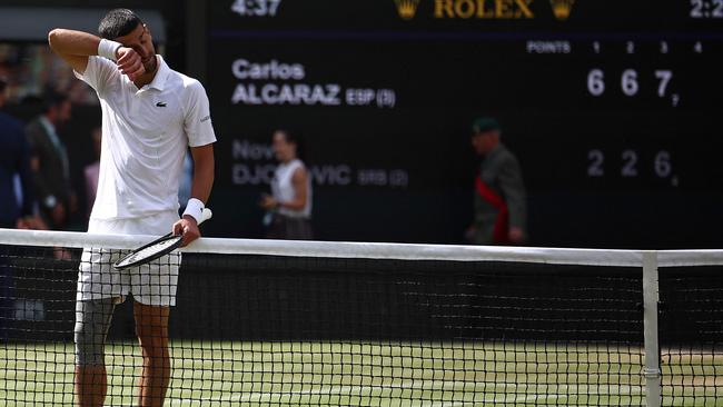 Novak Djokovic wipes his face during the match. Picture: AFP