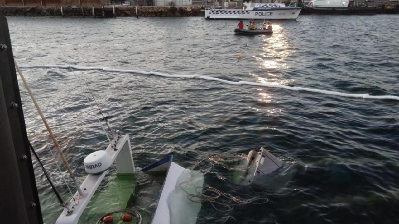 Crews deployed absorbent booms around the boat to prevent oil or fuel spreading. Picture: FRNSW