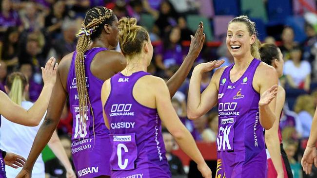 Laura Geitz (right) of the Firebirds is seen celebrating with team mates Romelda Aiken (left) and Mahalia Cassidy (centre) of the Firebirds during the Round 13 Super Netball match between the Queensland Firebirds and the Adelaide Thunderbirds this year. Picture: DARREN ENGLAND