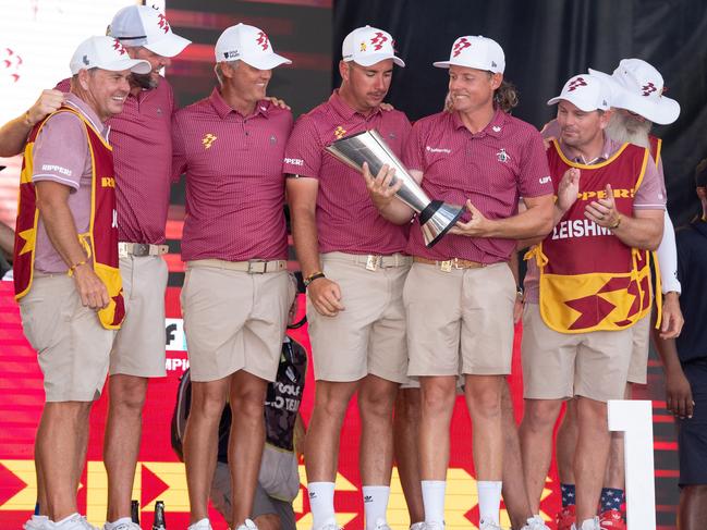 LIV Golf Team Champions, caddie, Lance Bailey, Marc Leishman of Ripper GC, Matt Jones of Ripper GC, Lucas Herbert of Ripper GC, Captain Cameron Smith of Ripper GC, caddie, Sam Pinfold, caddie, Matthew Kelly, and caddie, Nick Pugh, celebrate with the Team Championship Trophy on stage after the final round of LIV Golf Team Championship Dallas at Maridoe Golf Club on Sunday, September 22, 2024 in Carrollton, Texas. (Photo by Mateo Villalba/LIV Golf)