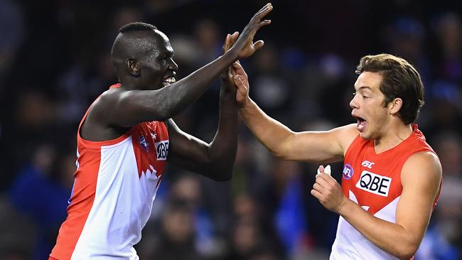 Aliir Aliir and Oliver Florent celebrate his match-winning goal.