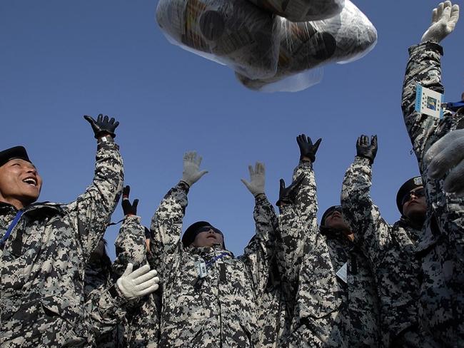 Releasing the balloons: A photo of people releasing balloons filled with outside information. Picture: Getty Images