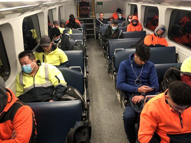 Commuters wearing masks on a busy train. One of Thursday’s cases travelled on four trains between Sydney and the Central Coast on Monday and Tuesday. Picture: NCA NewsWire / Nicholas Eagar