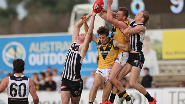 Glenelg’s Luke Reynolds gets sandwiched as he attempts a high mark against Port Adelaide at Alberton Oval. Picture: Cory Sutton