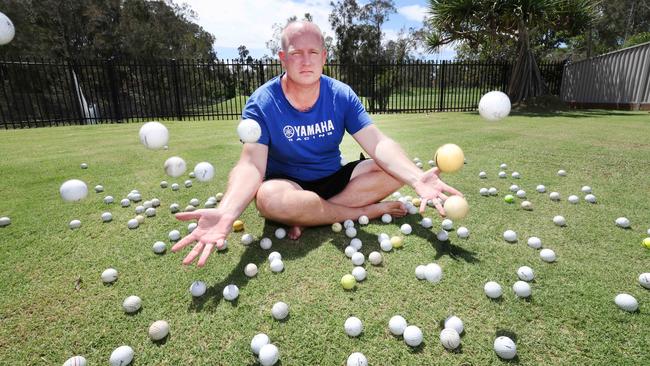 Resident Mick Cole is annoyed the Helensvale Golf Club aren't doing enough to stop errant golf balls from entering surrounding property, causing damage and safety concerns. Mr Cole has collected hundreds of balls in his backyard. Picture Glenn Hampson