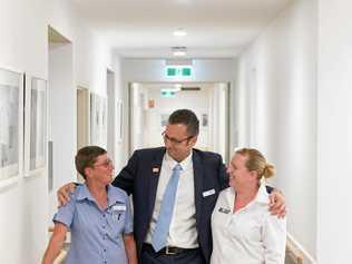 FOR THE TEAM: Kym Eckersley (left) and Rebecca Mathieson congratulated by CEO Whiddon Group Chris Mamarelis after winning national aged care awards. Picture: Adam Hourigan Photography