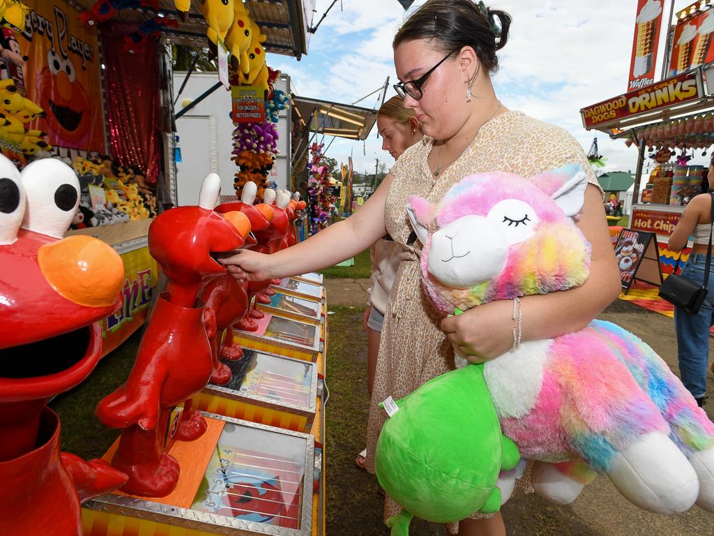 Jasmine Parish, of Lismore, tries her luck in sideshow alley at the Lismore Show. Picture Cath Piltz