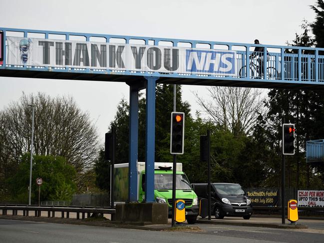 A 'thank you to the NHS' banner is displayed on a pedestrian bridge in Manchester. Picture: AFP