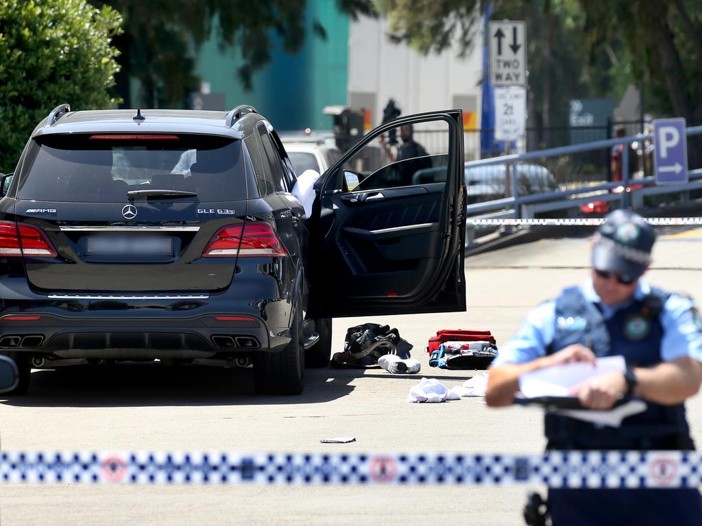 Forensics officers examine the scene and collect evidence. Picture: Toby Zerna