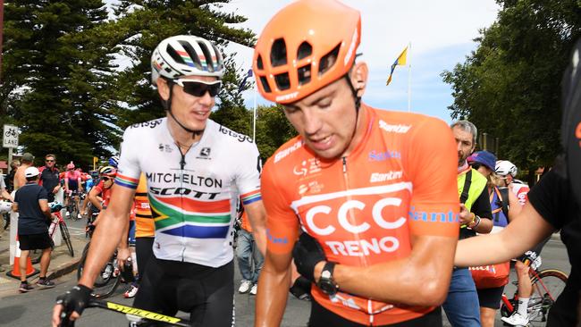 Daryl Impey of South Africa and Team Mitchelton-Scott consoles Patrick Bevin of New Zealand and CCC Team after his crash in the peloton in the lead into Strathalbyn. Picture: Daniel Kalisz/Getty Images)