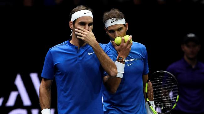 Roger Federer (L) and Rafael Nadal play a rare match on the same side of the net during the Laver Cup. Picture: AFP